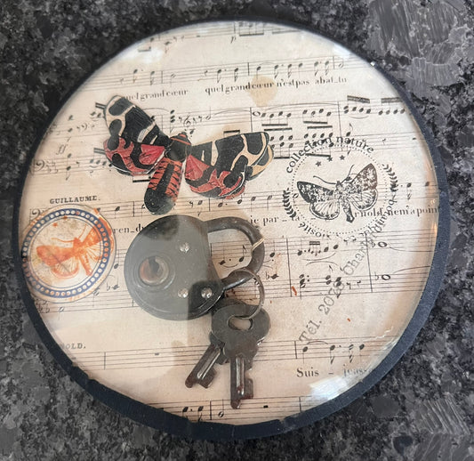 French Round Ephemera Collage – Glass Framed Wall Art with Keys & Insect Motif, 6”