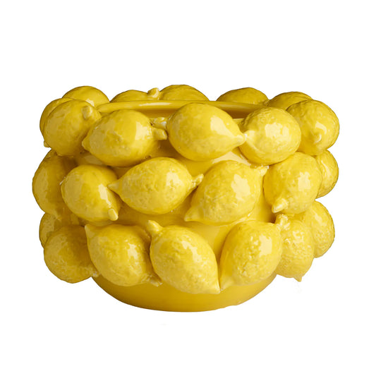 Yellow lemon-shaped bowl on a white background