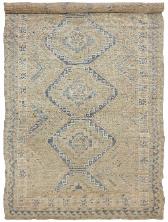 A traditional Persian Kurd rug with geometric patterns in beige, blue, and gray colors